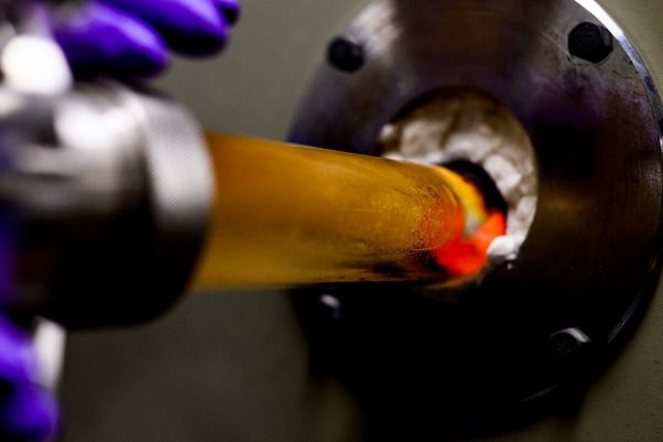 Ph.D. student Jianlin Li, works on the catalyst-free etching of sub-5 nm silicon nanowires in the Egan Research Center. Photo by Matthew Modoono/Northeastern University