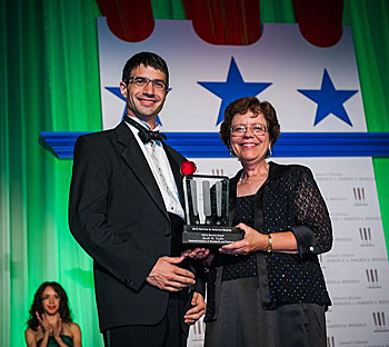 Taylor receiving the Service to America Medal from Acting Commerce Secretary Rebecca Blank image: Sam Kittner/Kittner.com