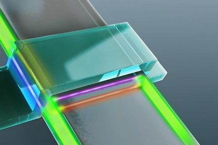 Rendering of the electronic device in which Majorana particles were observed. The device is made up of a superconductor (blue bar) and a magnetic topological insulator (gray strip). The Majorana particles result in transport channels (shown in red, pink, blue and yellow) in the electronic device.