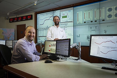 PNNL Scientist Jason Fuller (seated) is at the White House today to demonstrate how PNNL's GridLAB-D tool works to simulate all aspects of the energy grid from generation to end use, including markets, in unprecedented detail. Also pictured is David Chassin, project manager for GridLAB-D and a PNNL scientist.