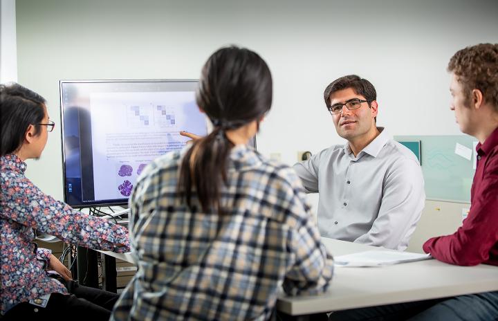 Saeed Hassanpour with his research lab and collaborators at Dartmouth's Norris Cotton Cancer Center will use a $1.5M National Cancer Institute grant to build new AI technologies for precision cancer care in lung cancer management.