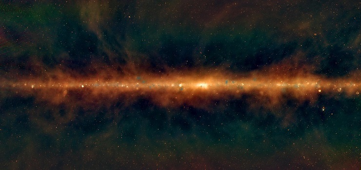 This image shows a new view of the Milky Way from the Murchison Widefield Array, with the lowest frequencies in red, middle frequencies in green, and the highest frequencies in blue. Huge golden filaments indicate enormous magnetic fields, supernova remnants are visible as little spherical bubbles, and regions of massive star formation show up in blue. [The supermassive black hole at the centre of our galaxy is hidden in the bright white region in the centre.]