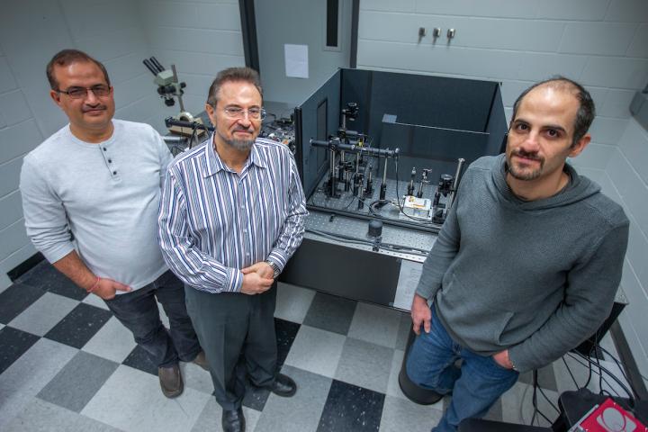 CAPTION Krishan Kumar Pandey, Valery Levitas and Mehdi Kamrani, left to right, study materials subject to high pressures in Levitas' Iowa State University laboratory.  CREDIT Photo by Christopher Gannon/Iowa State University