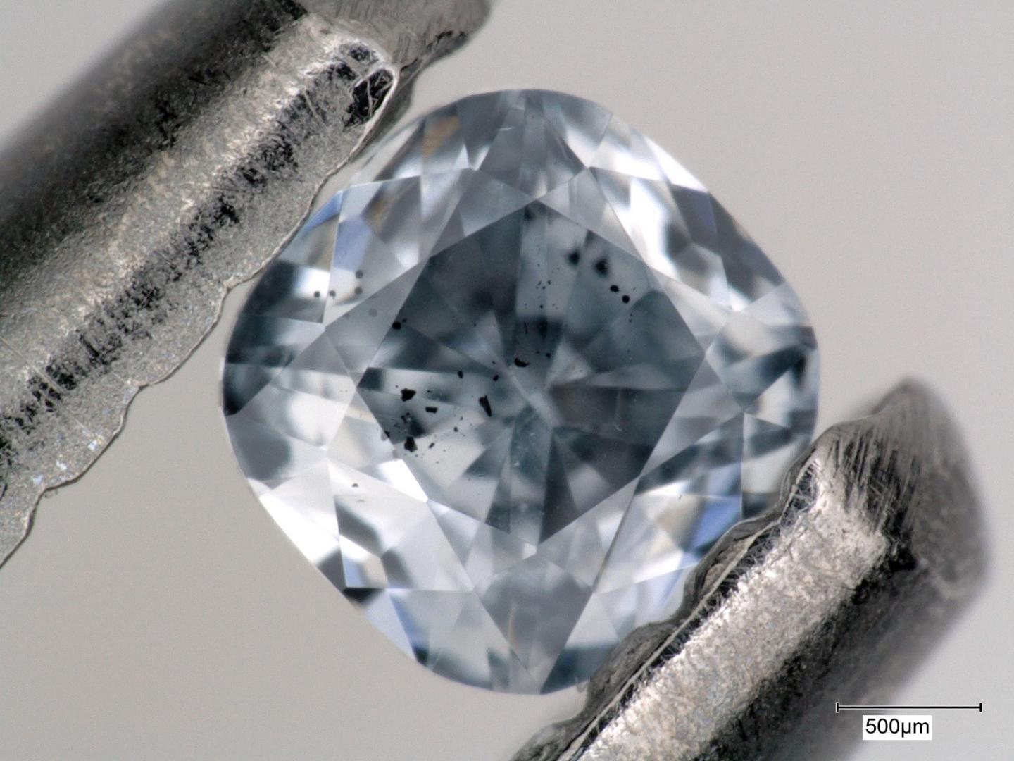 This close-up view of a super-deep diamond highlights its inclusions, seen here as black spots. Inclusions like these provide geochemical evidence that a sinking oceanic plate can carry water and other fluids deep into the mantle.  CREDIT Photo by Evan Smith/© 2021 GIA