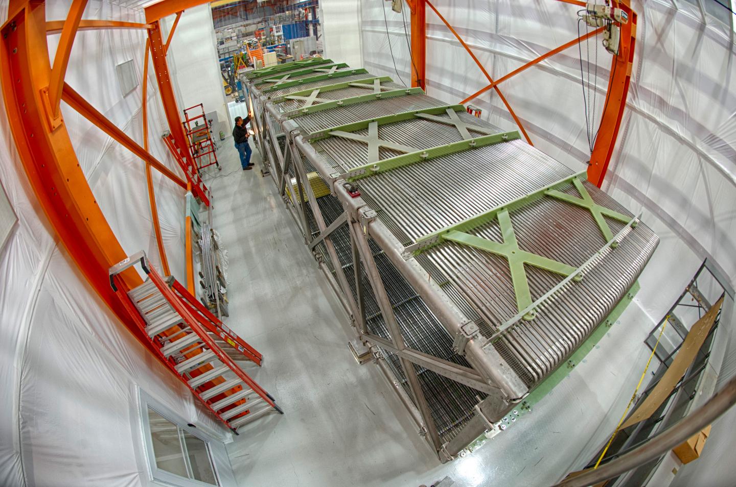 MicroBooNE's time projection chamber--where the neutrino interactions take place--during assembly at Fermilab. The chamber measures ten meters long and two and a half meters high.