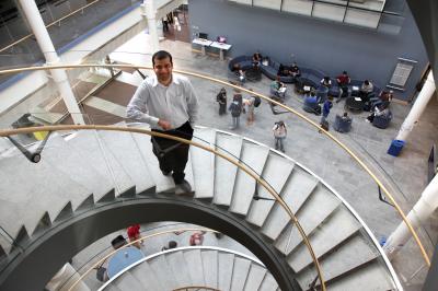 Assistant professor Zeeshan Syed poses outside his office in the Computer Science and Engineering Building at the University of Michigan.