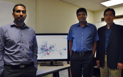 Aditya Johri, assistant professor of engineering education; Naren Ramakrishnan, professor of computer science; and G. Alan Wang, assistant professor of business information technology, meet at the Discovery Analytics Center at Virginia Tech. In the background is a sequence from a 4.5 minute YouTube video set to music by Moby (www.youtube.com/watch?v=Oqd6vpjzqBI), which illustrates the evolving connectivity of the past 10 years of conference papers presented at major engineering education meetings (IEEE/ASEE-ERM Frontiers of Education).