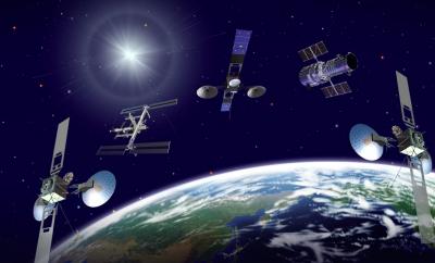 Three TDRS satellites, the International Space Station (ISS) and Hubble Space Telescope orbit a blue-green Earth in this artist's concept. The TDRS network facilitates around the clock communication access between ground stations and other satellites and the ISS.