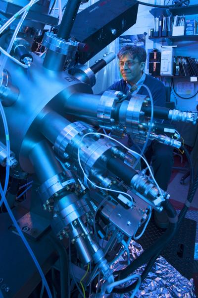 This photo shows Nitin Samarth in his research lab at Penn State working with the molecular beam epitaxy equipment, which provides an ultra-pure environment for his research team's experiments.