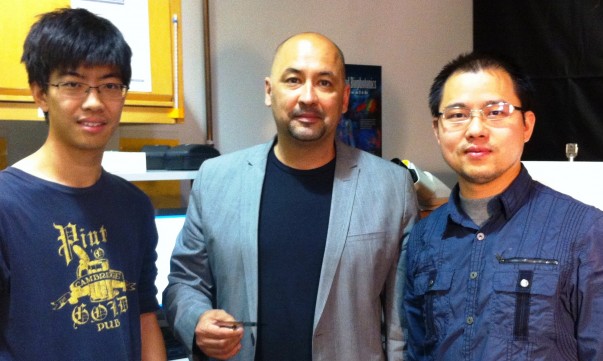 Alexander Balandin, center, stands with two of his graduate students, Guanxiong Liu (left) and Zhong Yan (right)