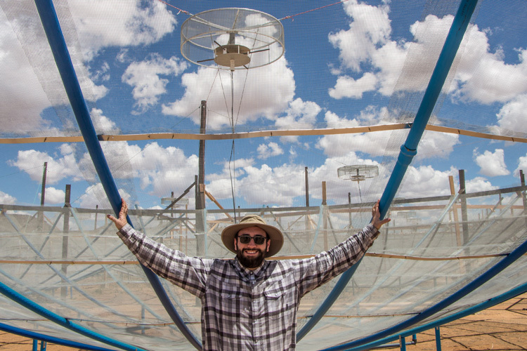 UC Berkeley astronomer Joshua Dillon under one of the HERA radio dishes in 2017. (Photo courtesy of Joshua Dillon)