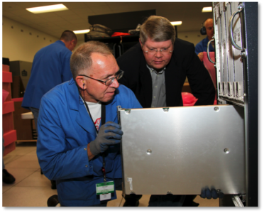 OLCF Project Director Buddy Bland with personnel from Cray as the Jaguar supercomputer is upgraded.