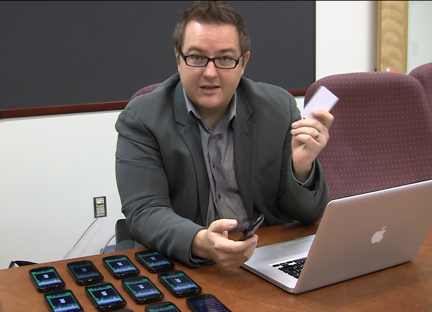 Jules White demonstrates how, using a laptop, he can put smart phones under lockdown with new software that puts physical boundaries around information in cyberspace.