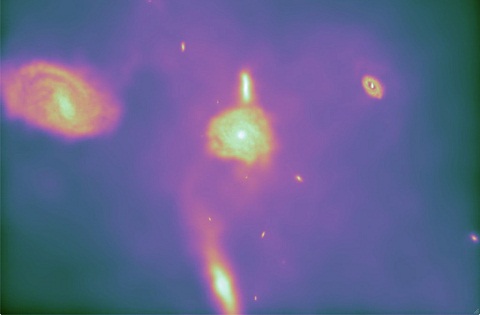 This still frame is taken from the Arepo-generated animation shown above. It demonstrates Arepo's key ability to produce realistic spiral galaxies. Previous simulations tended to yield blobby galaxies lacking distinct spiral structure. Credit: CfA/UCSD/HITS/M. Vogelsberger (CfA) & V. Springel (HITS)