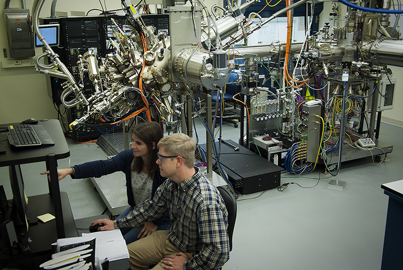 Researchers at various Microsoft Quantum lab sites, including the lab of Michael Manfra at Purdue University, collaborated to create a device that could bring more scalable quantum bits. Pictured here are Purdue researchers Candice Thomas (left) and Geoff Gardner. (Microsoft Station Q Purdue photo)